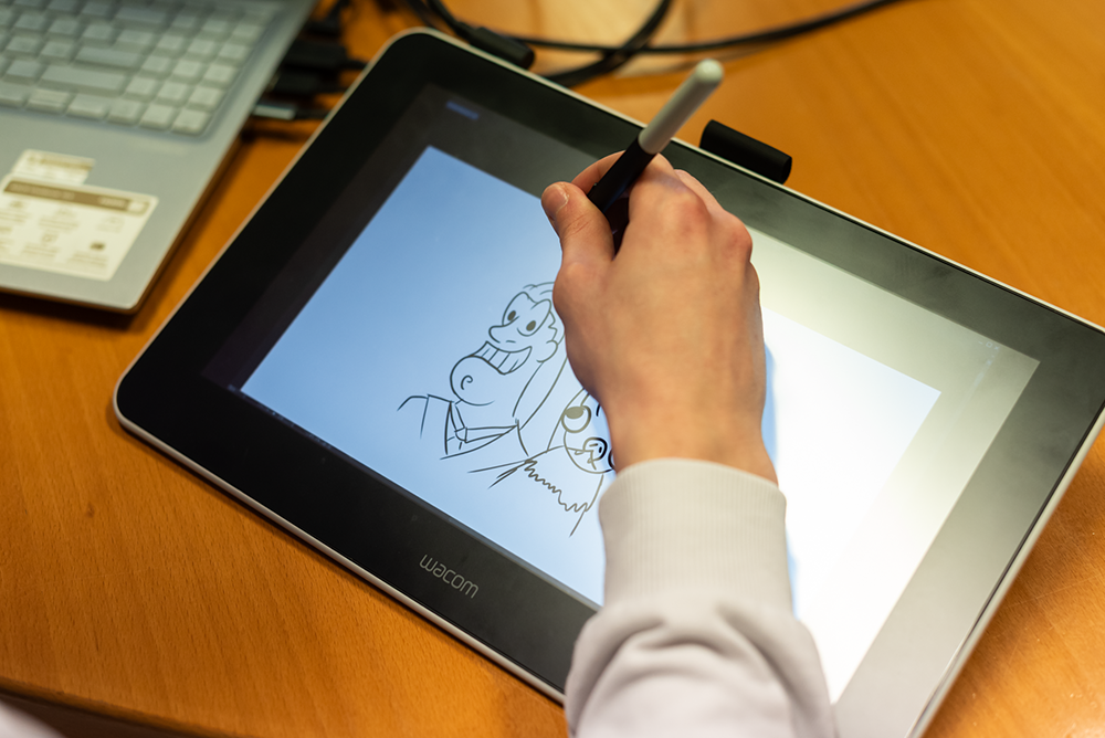 Lo studente di fumetto Gabriele Mauri impegnato in una sessione di live sketch presso l'evento MUSA